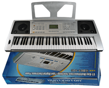 Load image into Gallery viewer, Huntington USA 61 Key electric keyboard with music rack and AC adaptor on blue packaging box