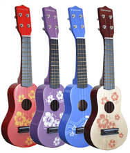 Charger l'image dans la galerie, Set of colorful children soprano ukuleles with Hawaiian floral designs and wood soundboard.