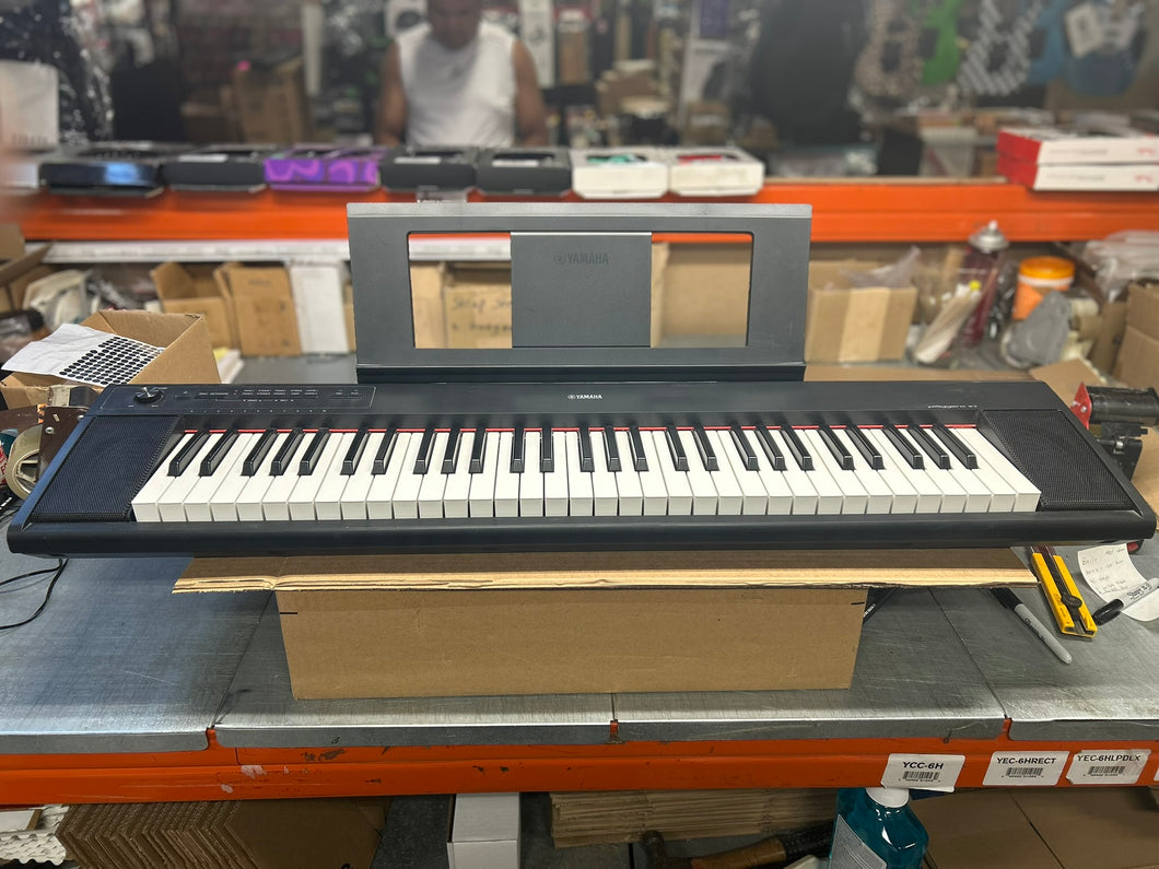 Yamaha NP12 Piaggerro 61 Key Portable Keyboard with Music Rack & AC Adaptor - Black - Pre Owned